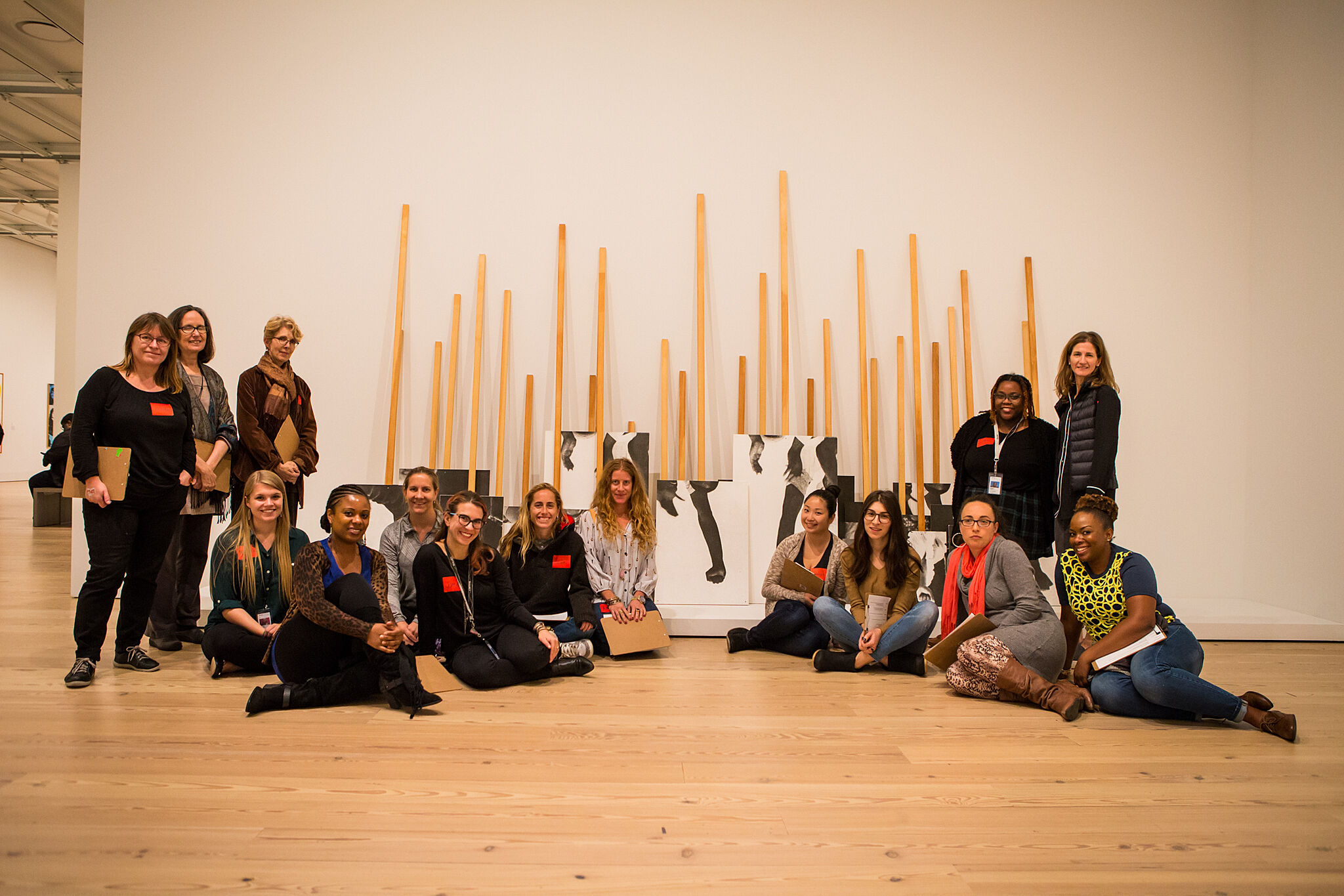 A group photo of teachers in a gallery