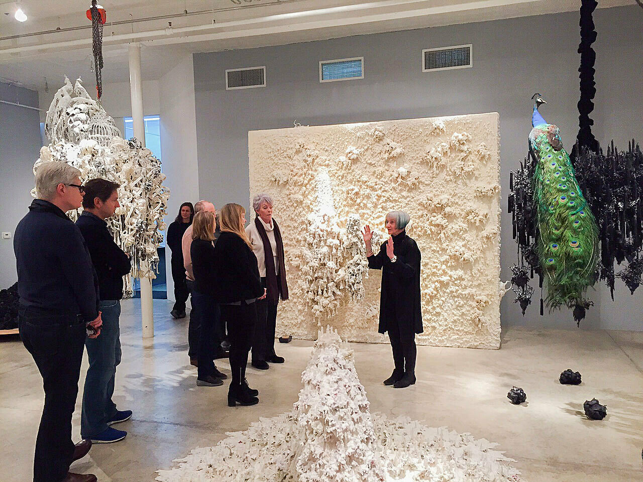 Artist talks in front of her white installations