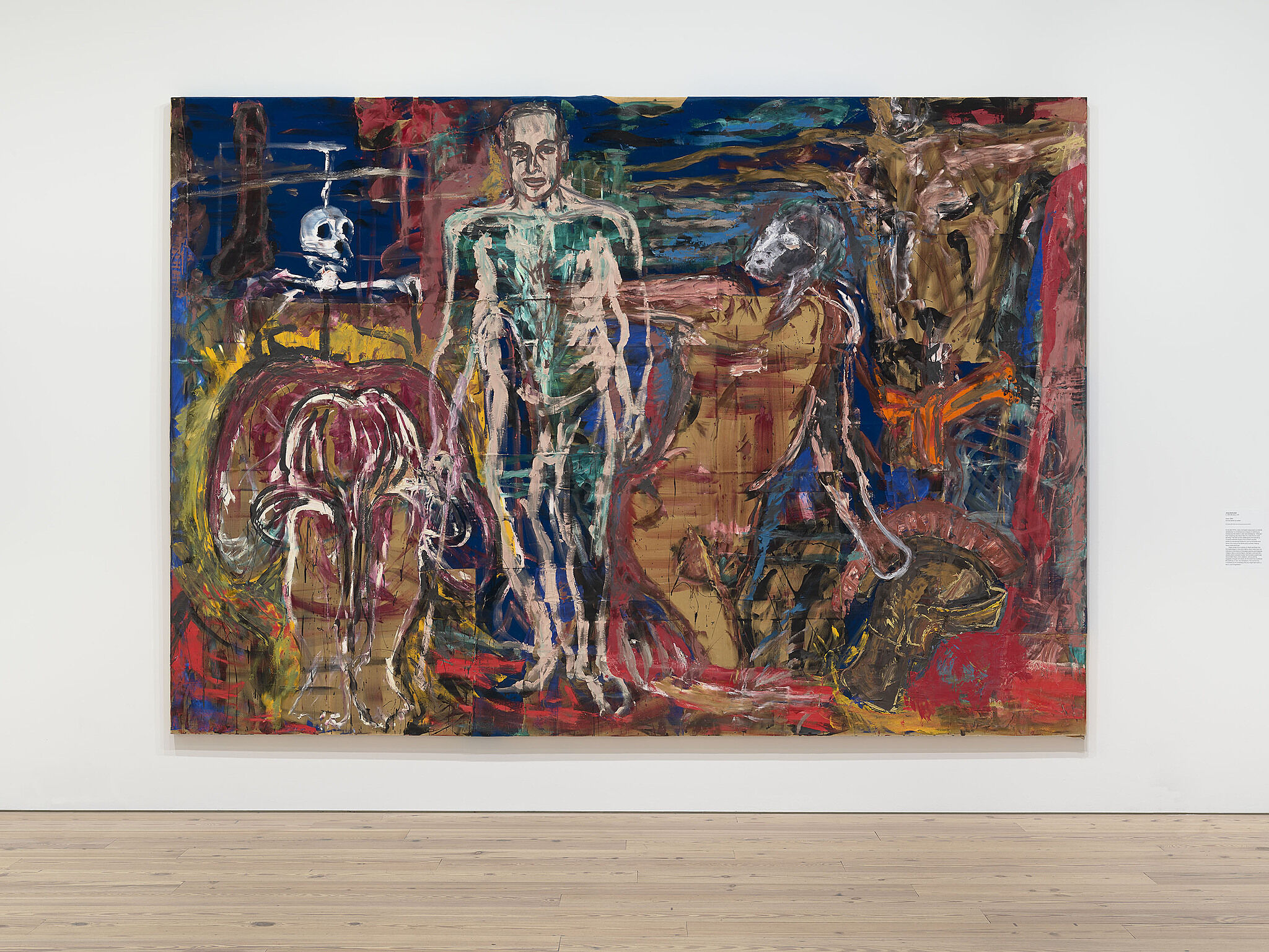 Skeleton type figures in a large painting hang on a gallery wall.