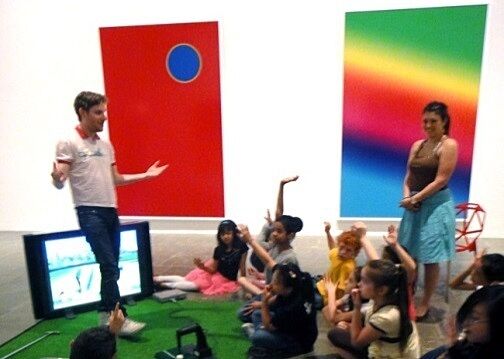 cory explaining art to children in gallery