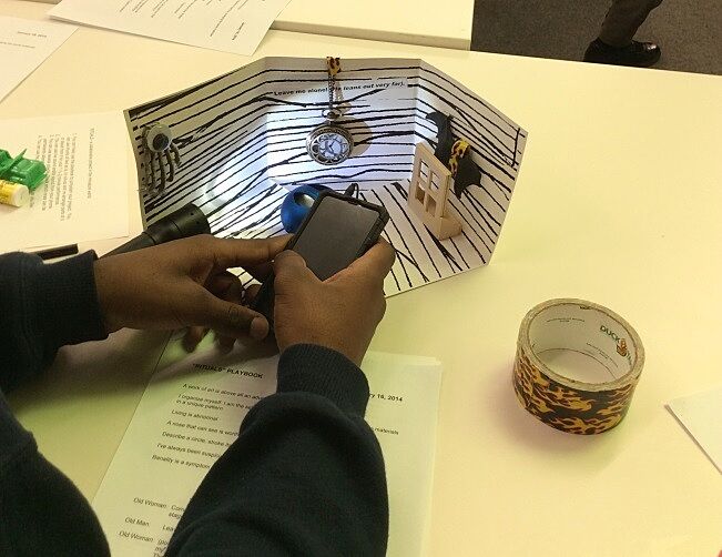 student illuminating a studio project