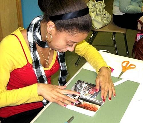 girl is constructing artwork on table