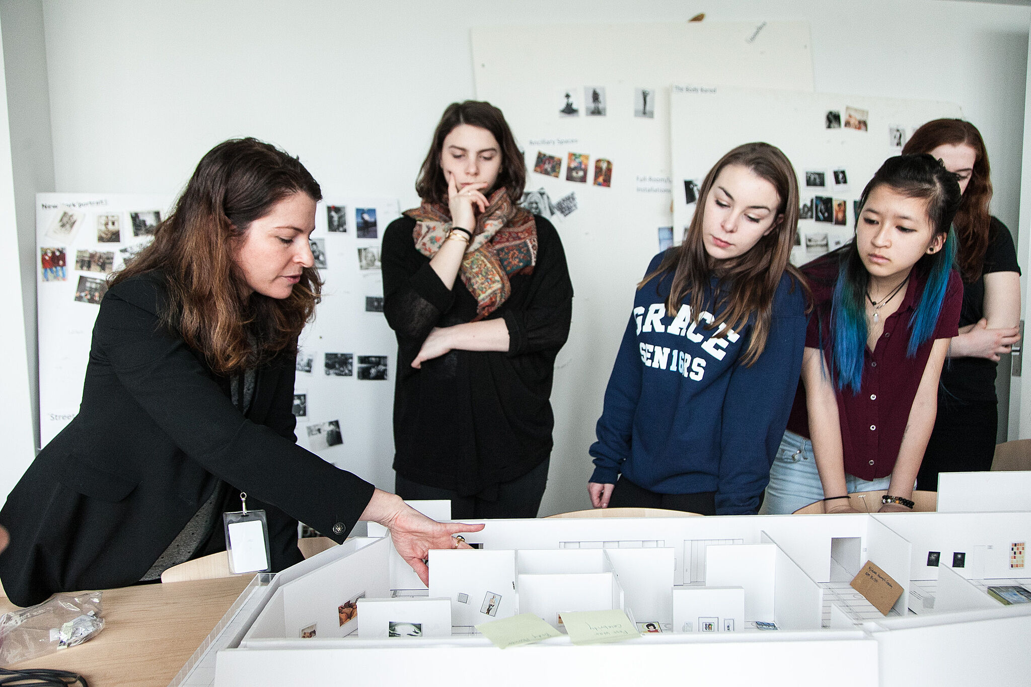 curator explaining model on table