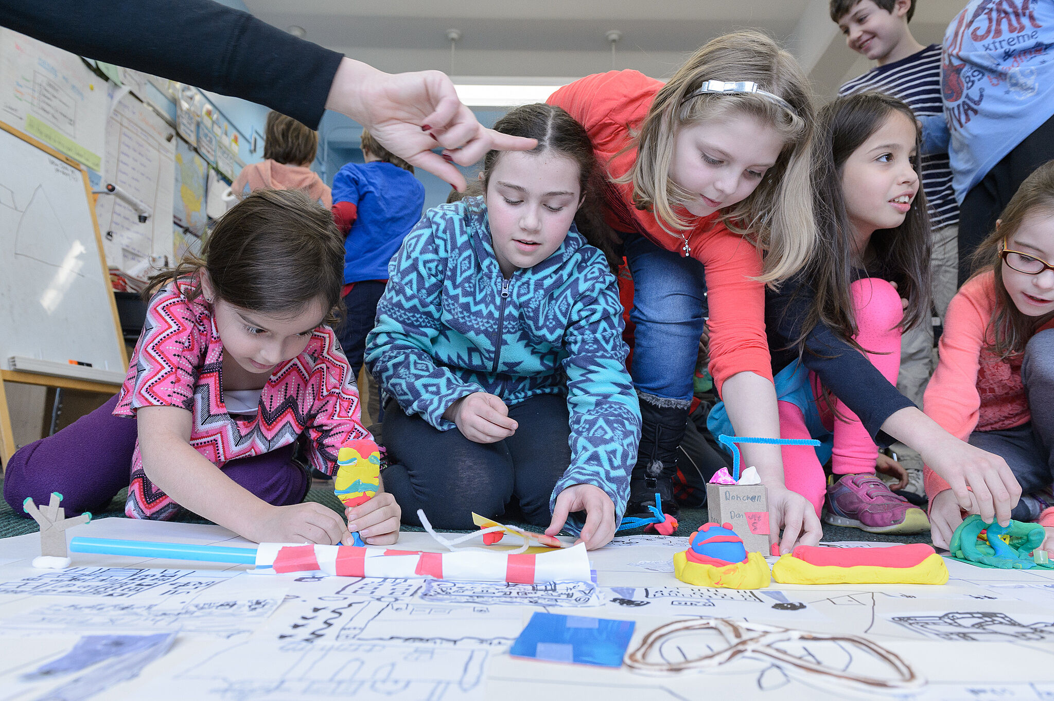 Children working on large map.