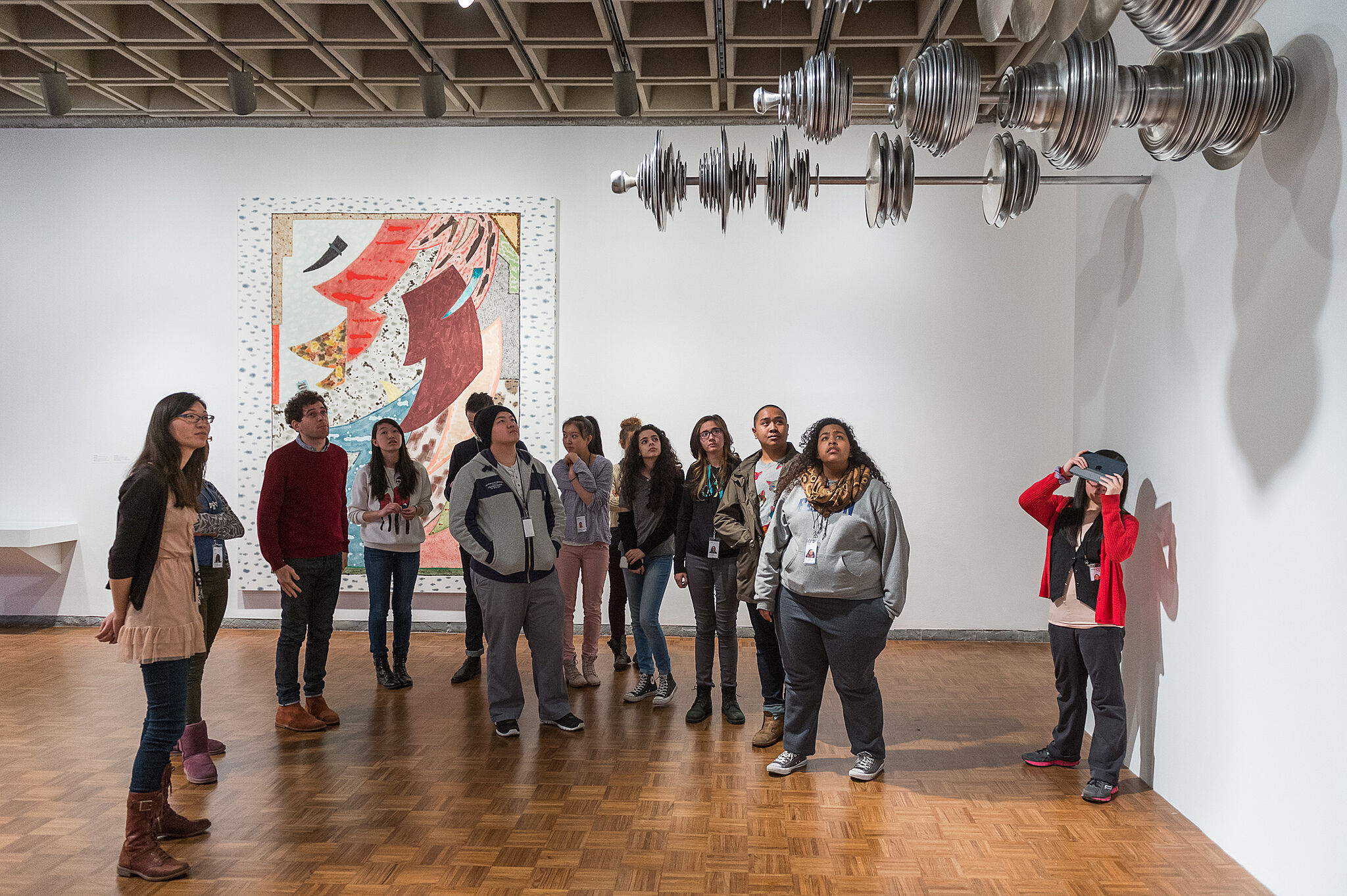 Teens take a tour of the Biennial exhibit with an artist.