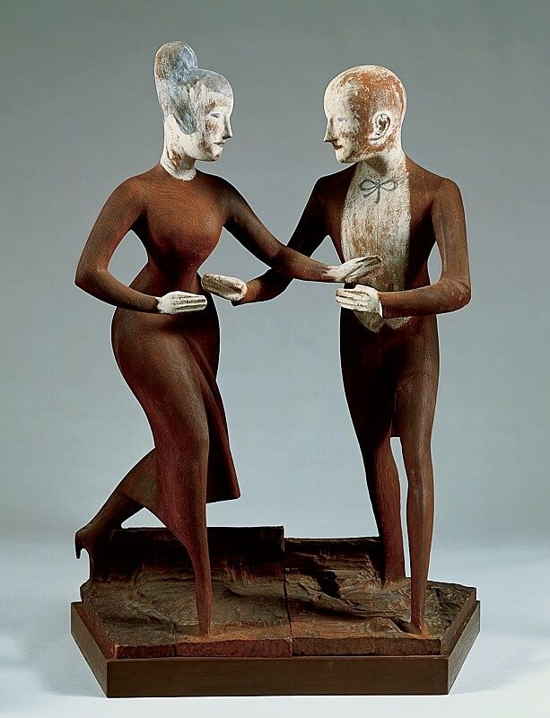 A sculpture of a man and woman dancing.