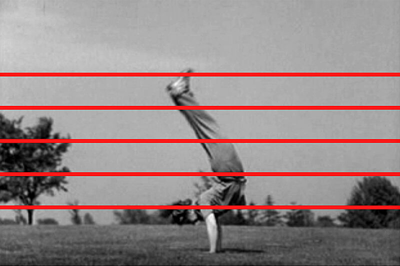 A man doing a handstand in a black and white photo with five red lines running through it.