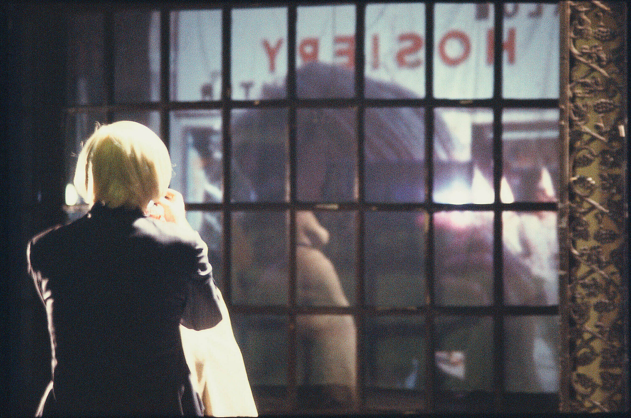 An artwork featuring Andy Warhol looking out the window.