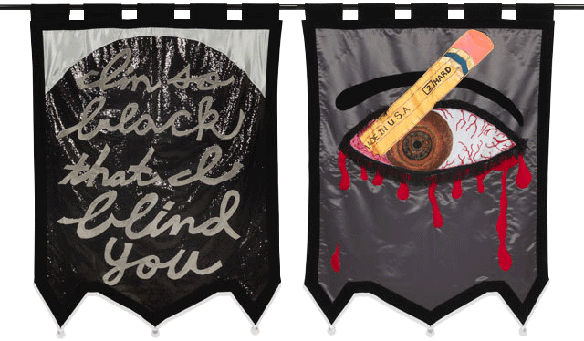 Two banners. One that reads "I'm so black that I blind you," and another depicting a pencil stabbing an eye.