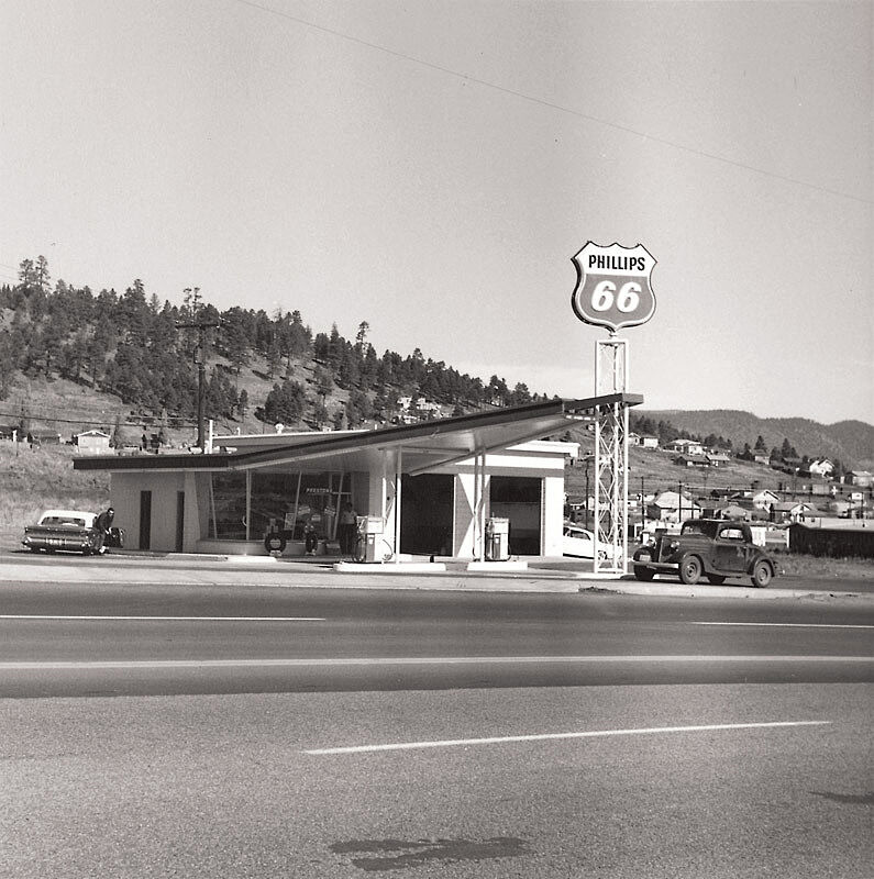 A roadside gas station in black and white. Photo by Edward Ruscha.