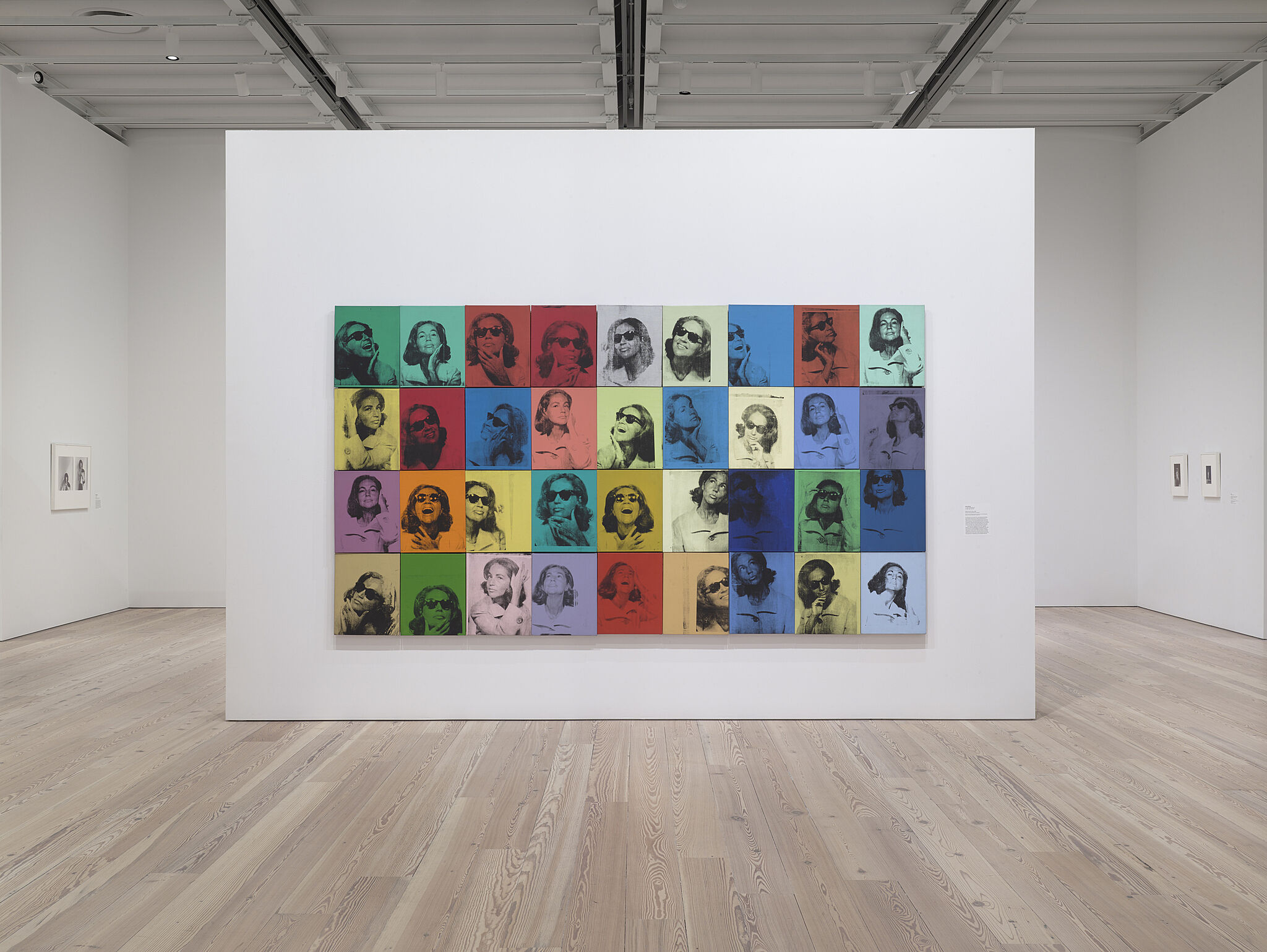 Warhol like portraits on a wall.