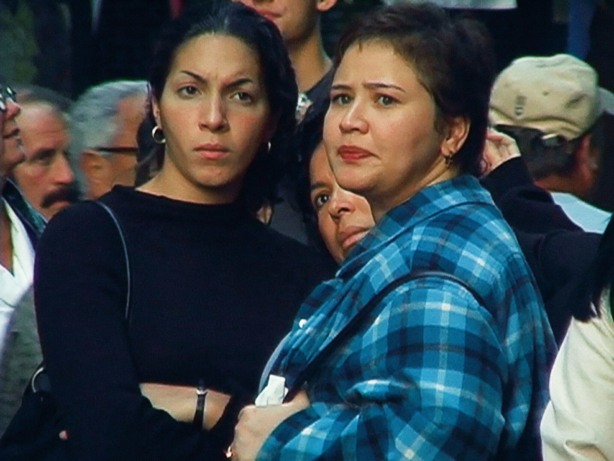 Two women pictured with intense expressions.