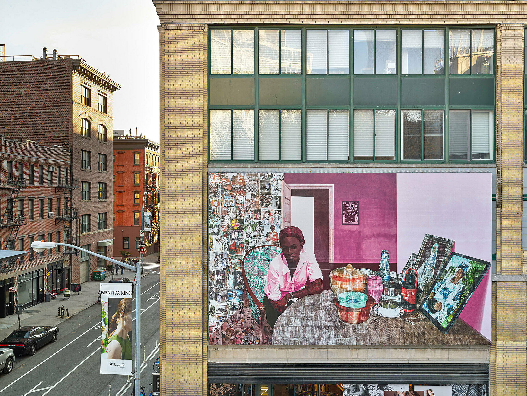 Large painting sits on a building outside of the Whitney Museum.