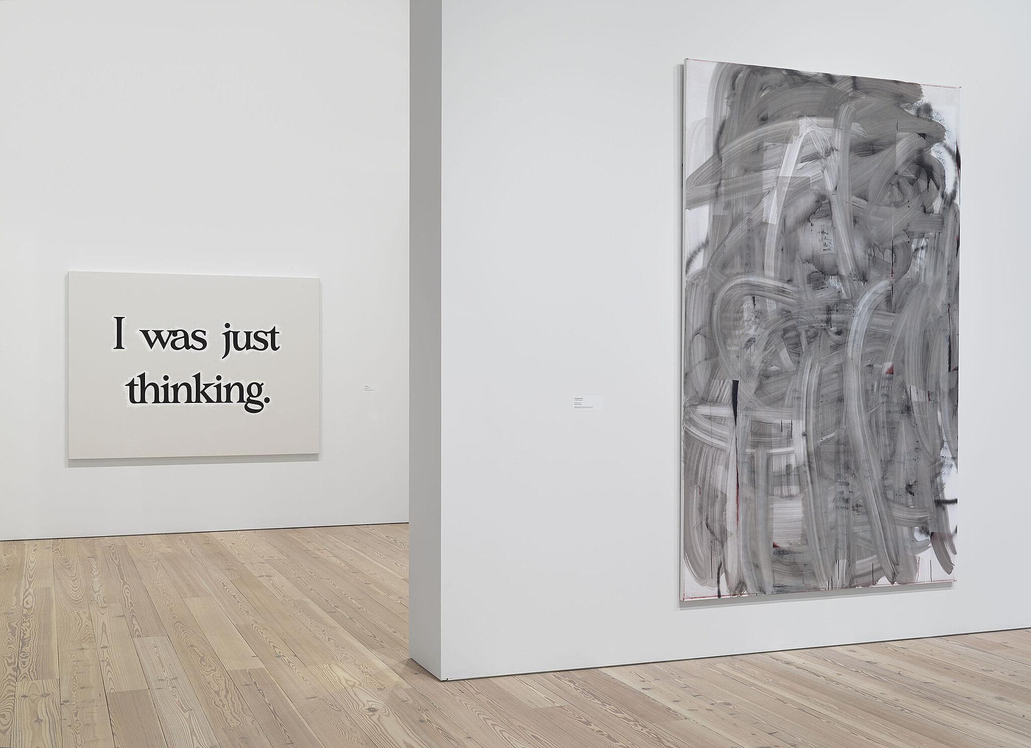 A black and white abstract artwork and a poster with text "I was just thinking" in the gallery.