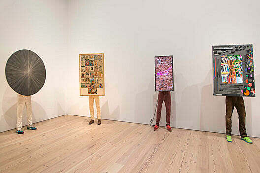 sculptures of legs supporting paintings