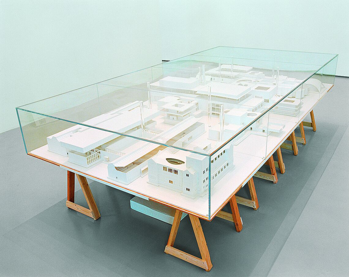 An installation view of a diorama in a glass case.