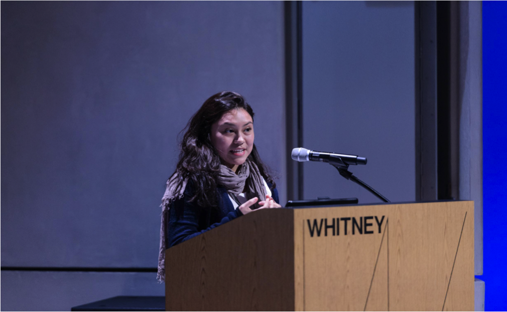 Youth Insights Leader Maria addresses the audience