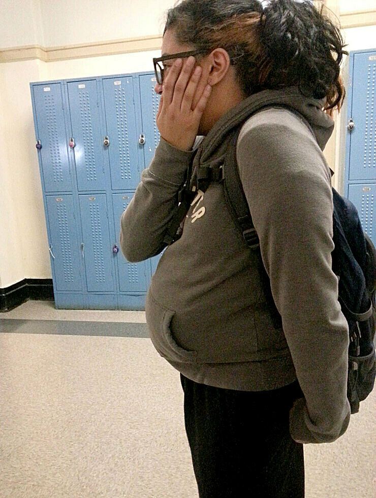 A teen pretends to be pregnant at school.
