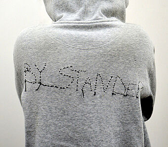 A grey sweatshirt with text on it.