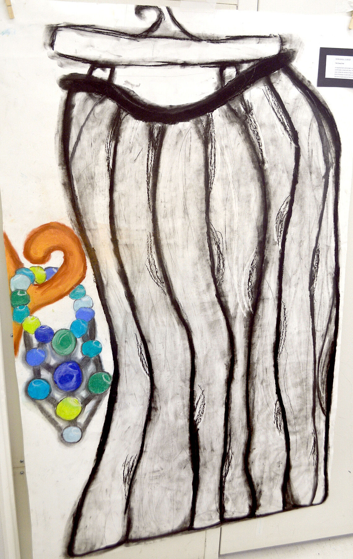 Drawing of a skirt on a hanger.