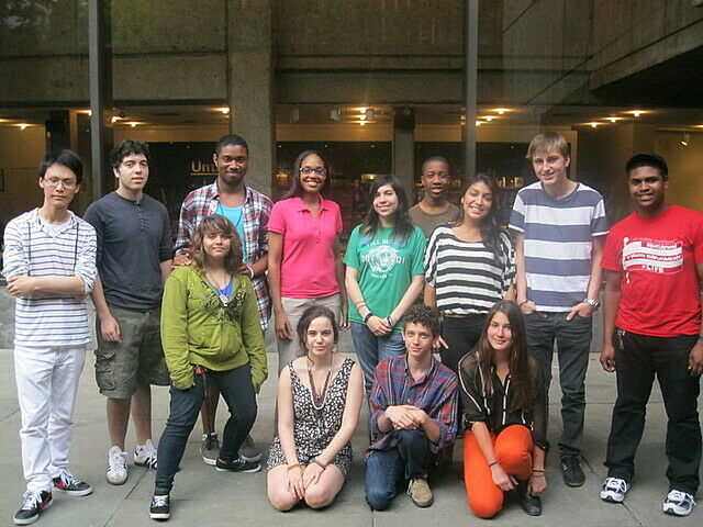 Teen artists leaders posing together in front of the Whitney Museum. 