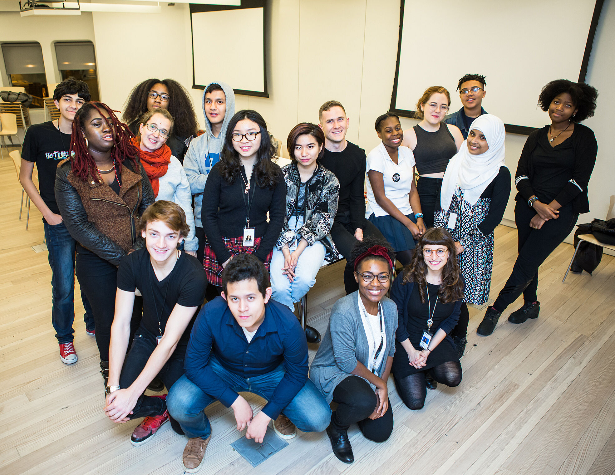 Teens and Whitney YI staff members posing for a group photo.
