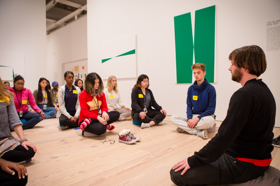 Artist Leidy Churchman meditates with YI Artists.