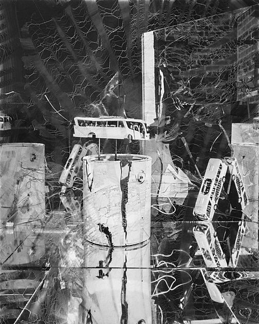 A print of small buses and large paint cats in an abstract space.