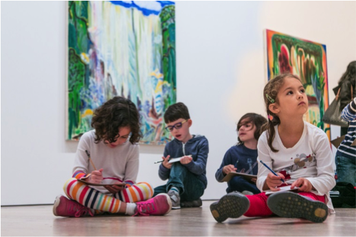 Students sketch in the Biennial galleries