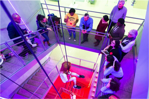 Gotham students, teachers, and families explore the Biennial installation in the stairway