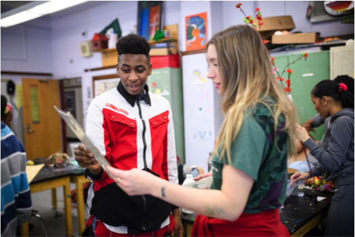 Artist Jessi Reaves talk to a student