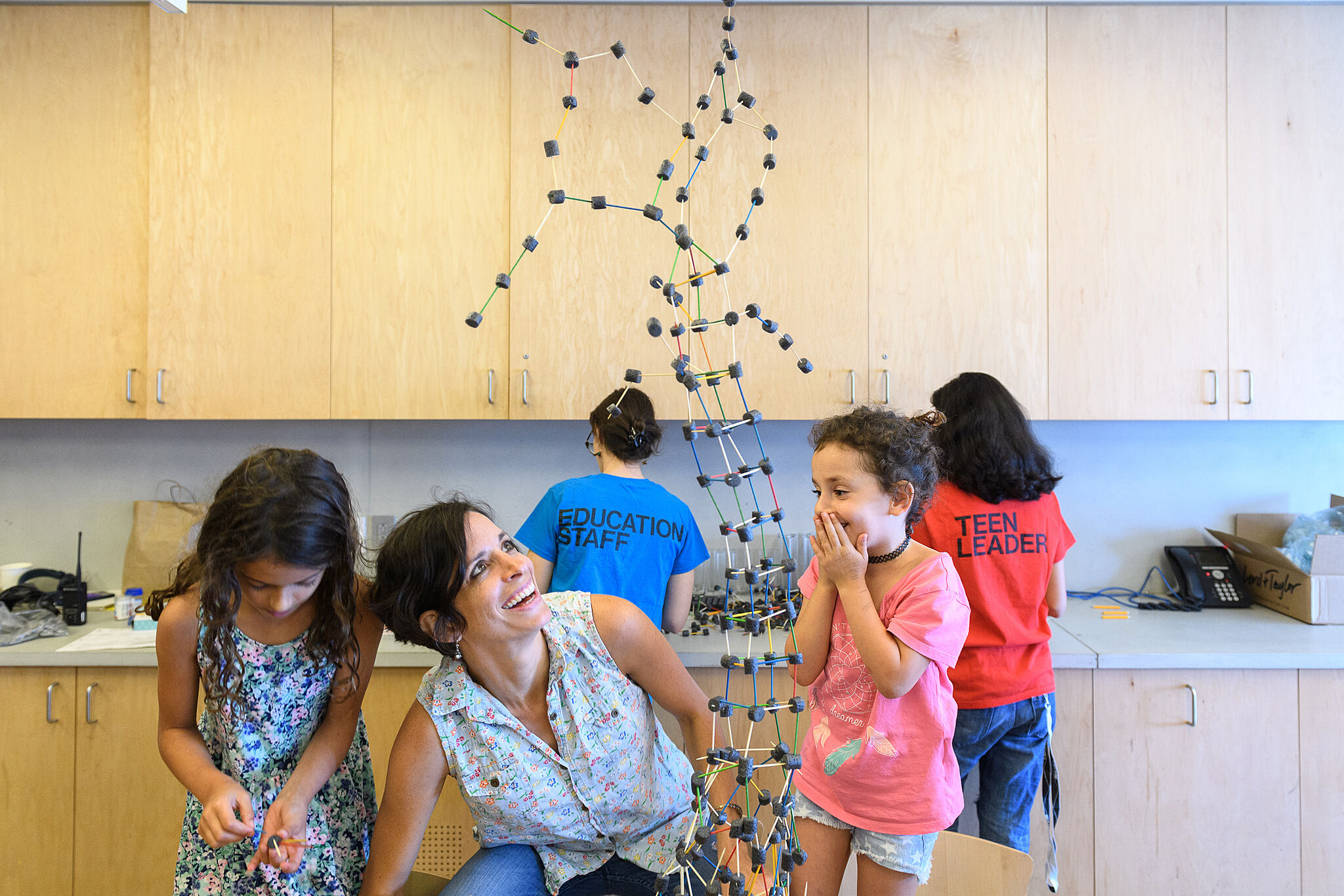 A family creates the tallest balancing sculpture at Open Studio event