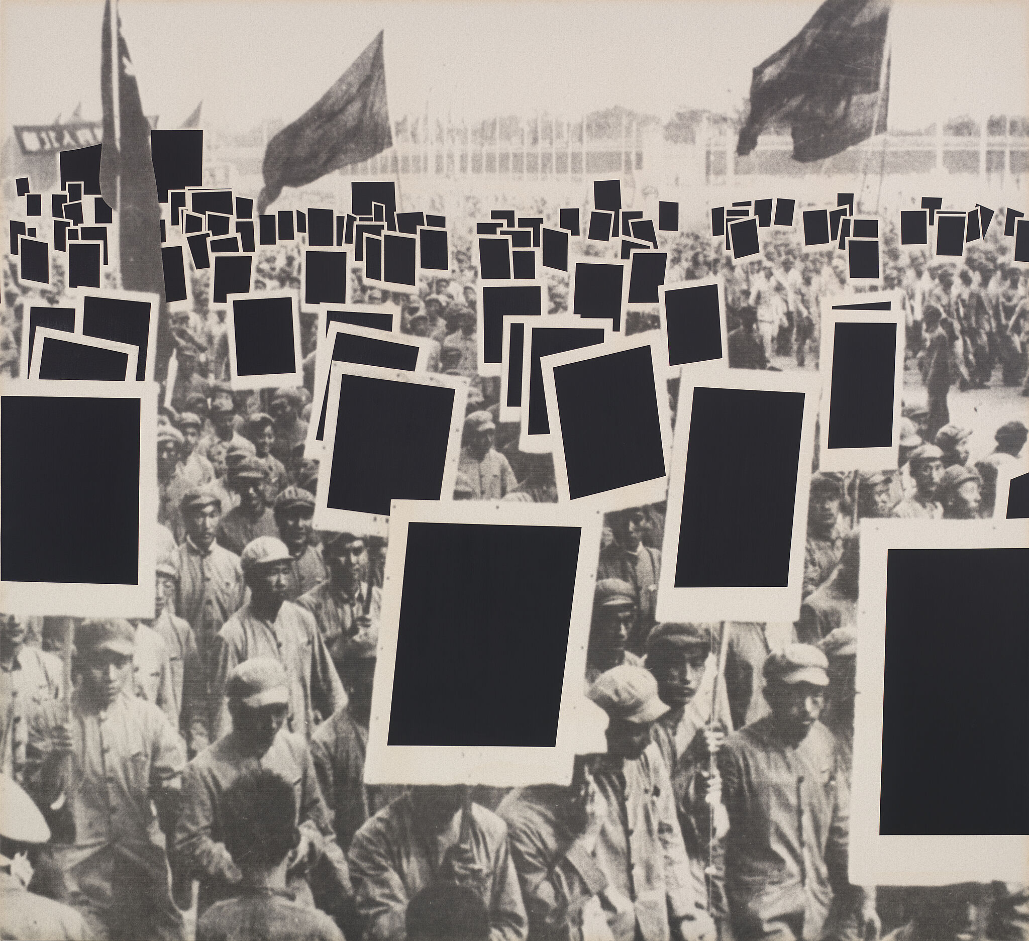 Black and white photograph of protesters with black rectangles covering their signs.