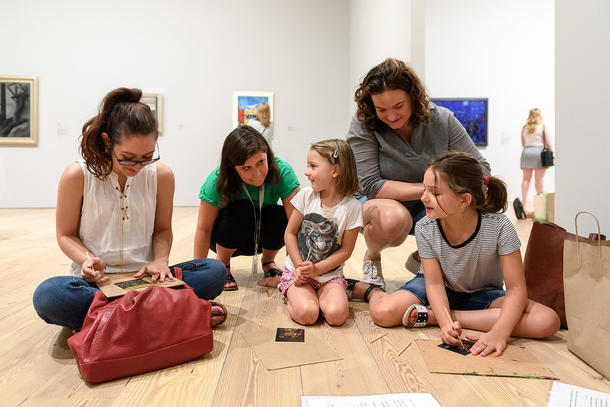 A family doing an activity in the galleries together