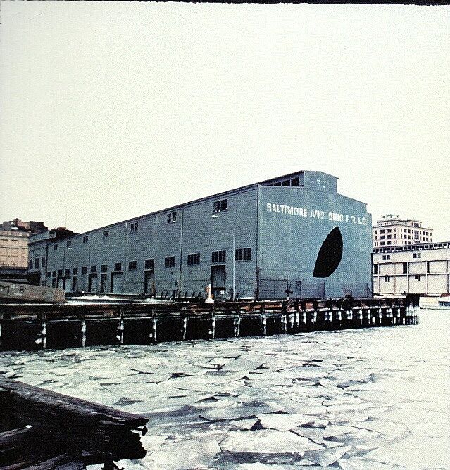 A shed on a pier with a hole cut into it