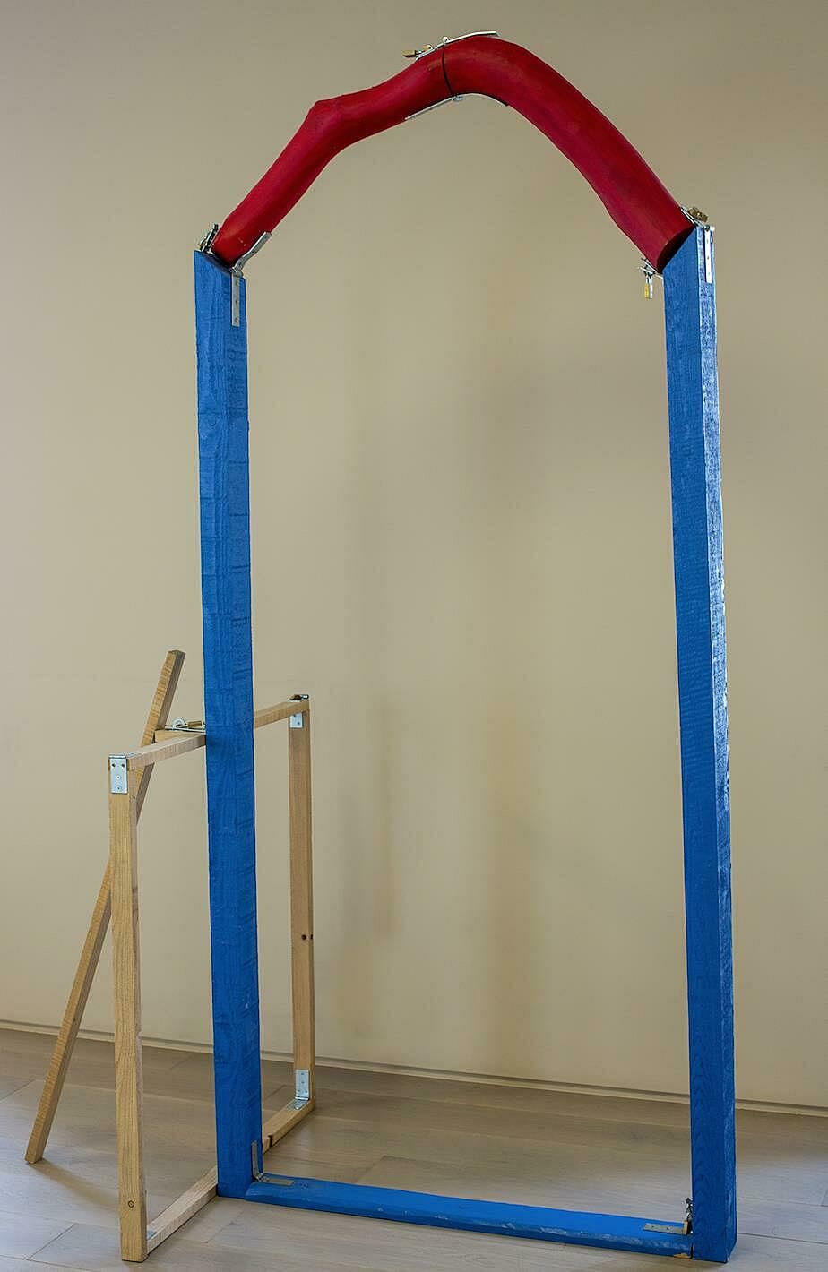 blue and red sculpture made of wood