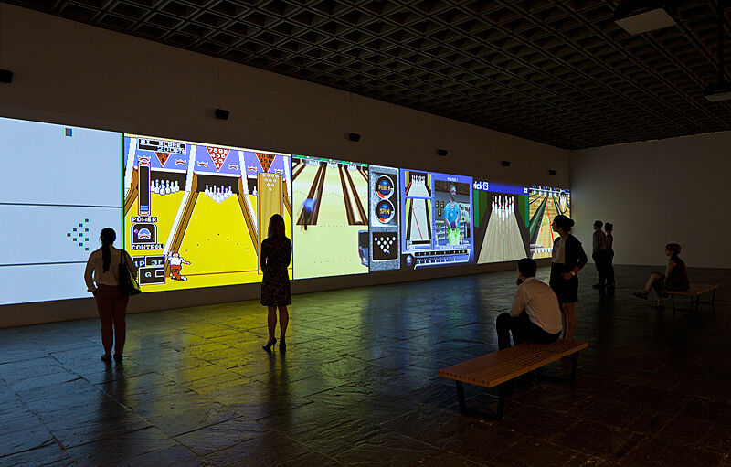 Installation view of Various Self Playing Bowling Games (aka Beat the Champ) by Cory Arcangel. 