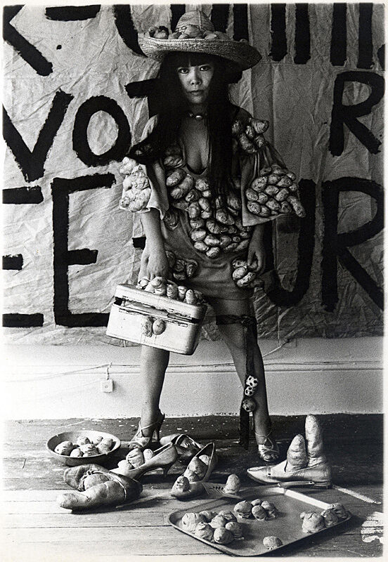 Woman in outfit covered in objects.