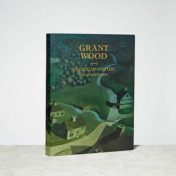 Hardcover book titled "Grant Wood: American Gothic and Other Fables" with an illustrated rural landscape cover.