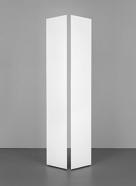 Two symmetrical eight-foot white columns with space in between hovering over a gray background.