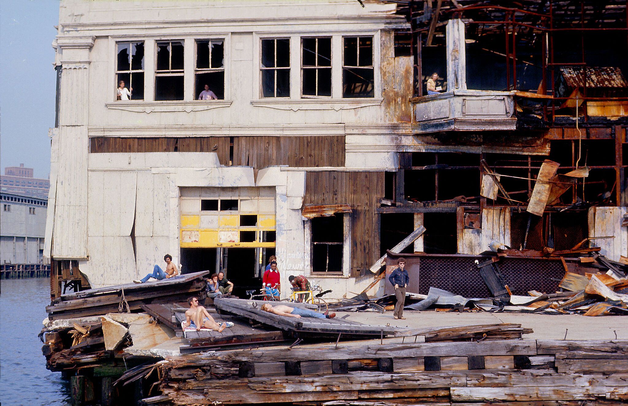 Photograph of people sunbathing on the New York City's west side piers.