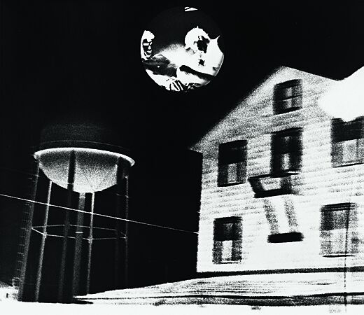 A print of a house and a water tower.
