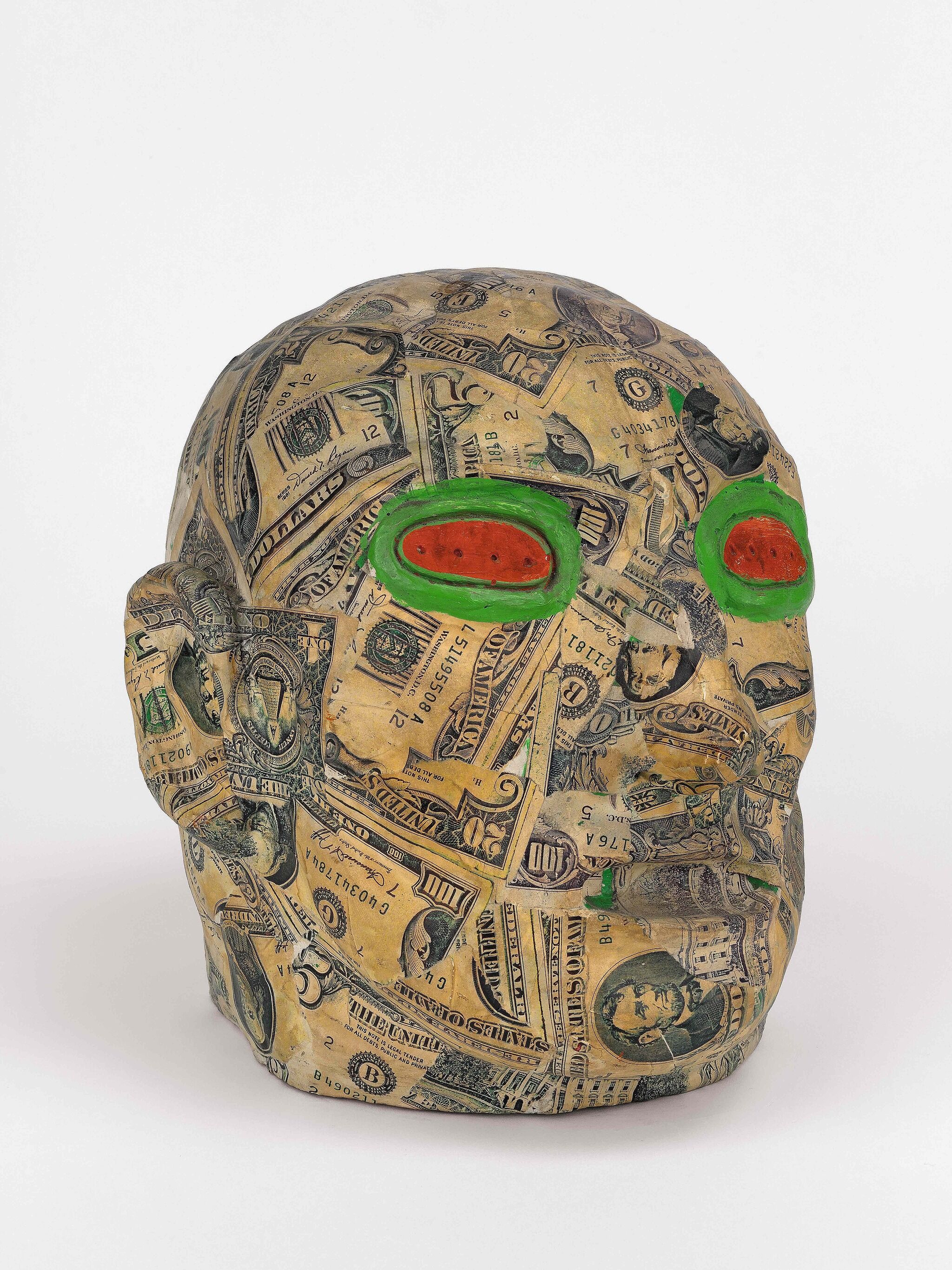 Head covered in dollars and paint.