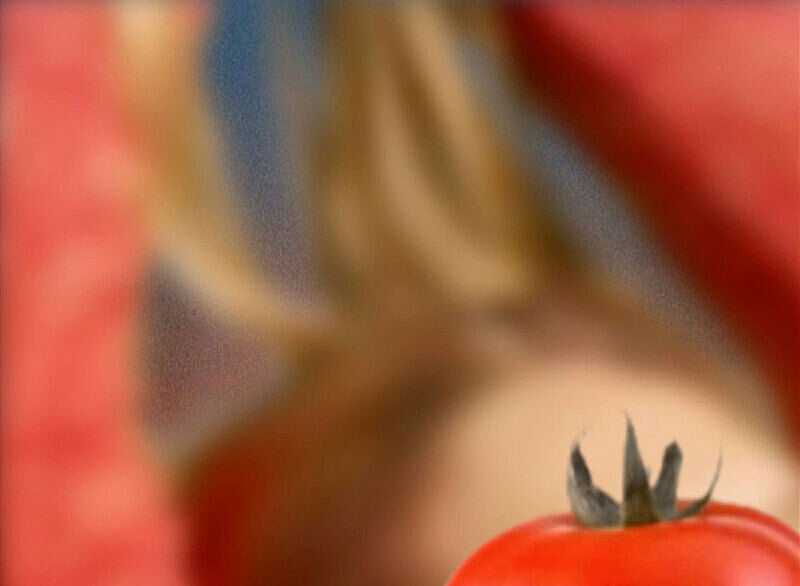 A still shot from a video of a tomato. 