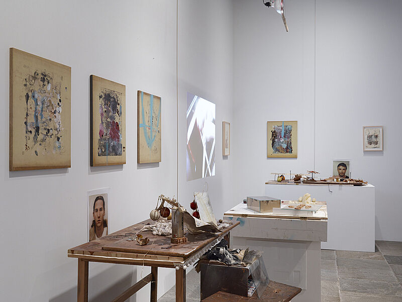 Installation view of artworks on the wall and on the table. 