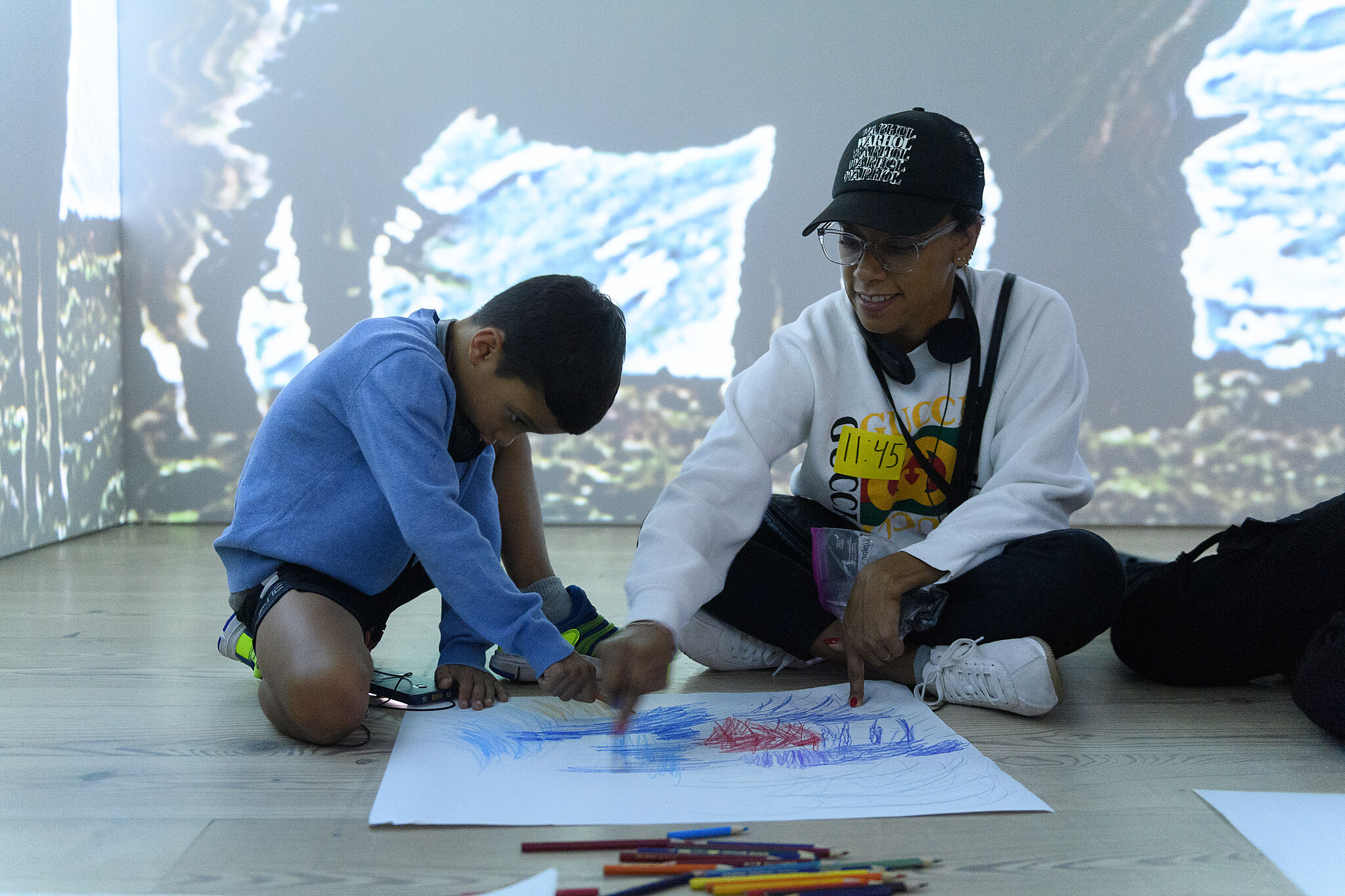 Families making art together in the galleries. 