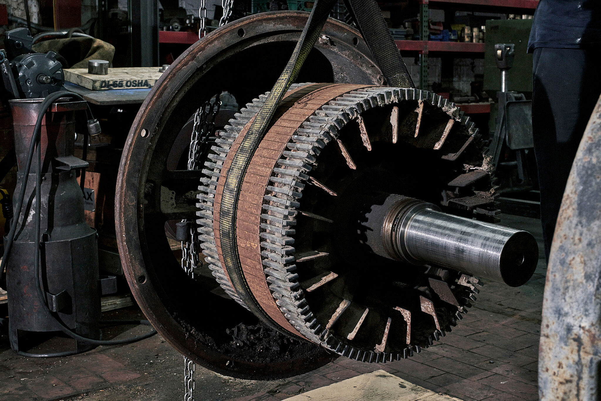 Photograph of a cotton gin motor being repaired