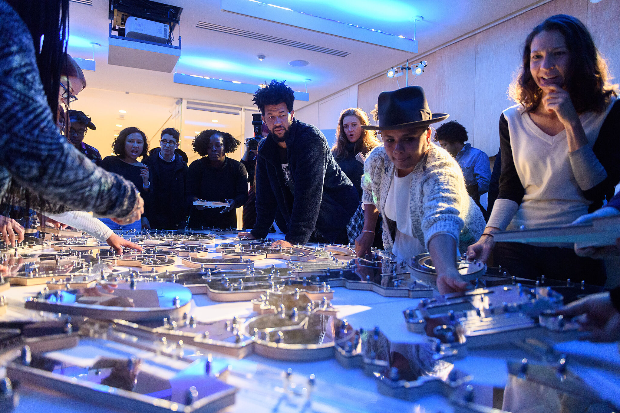 Study Session attendees assemble a puzzle created by artist Damien Davis