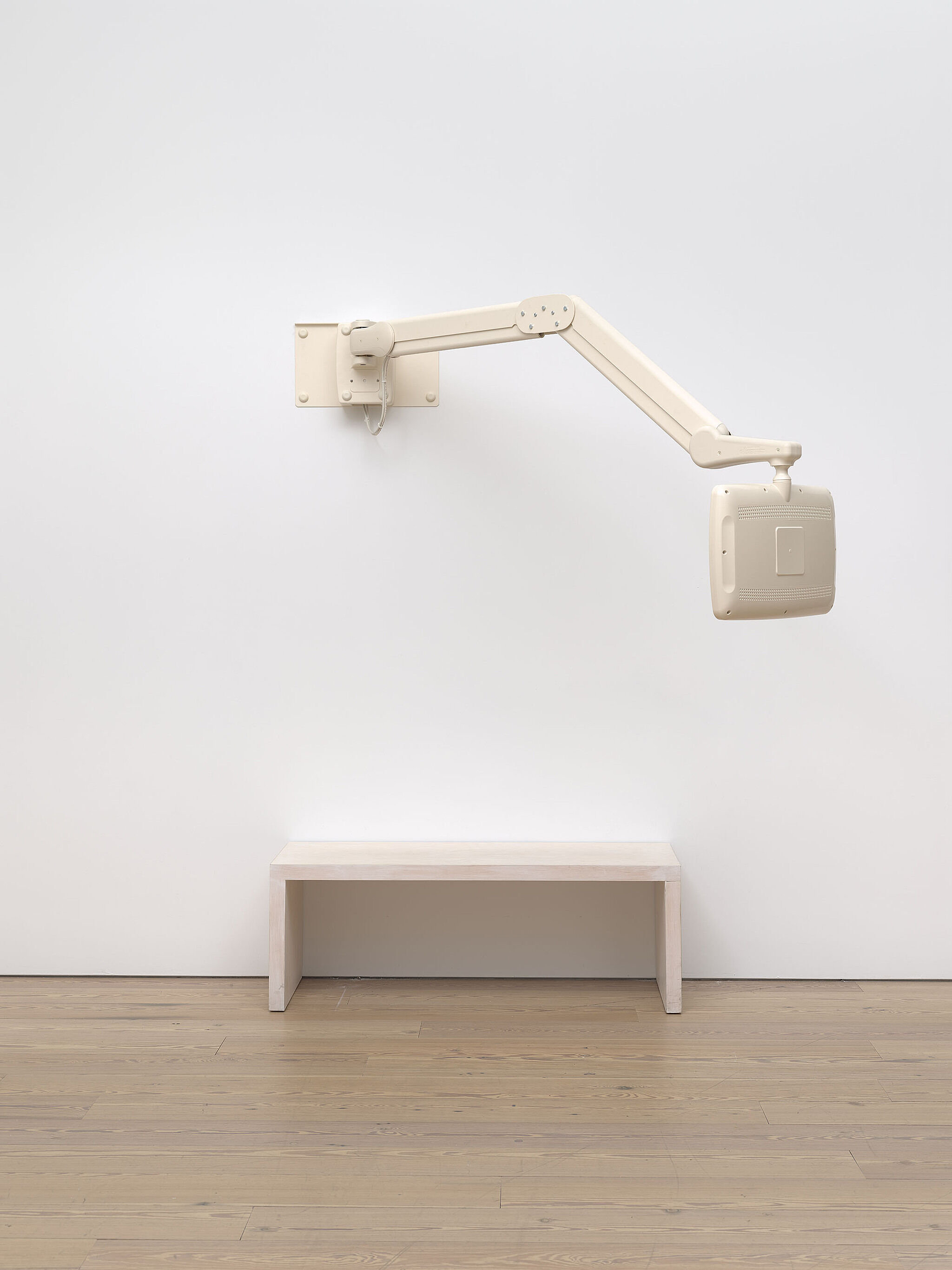 A photograph of a sculpture in a gallery.
