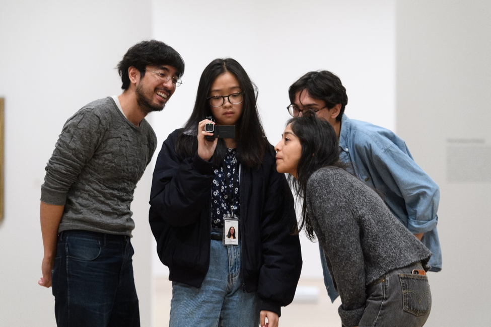 A photograph of artists working with youth.